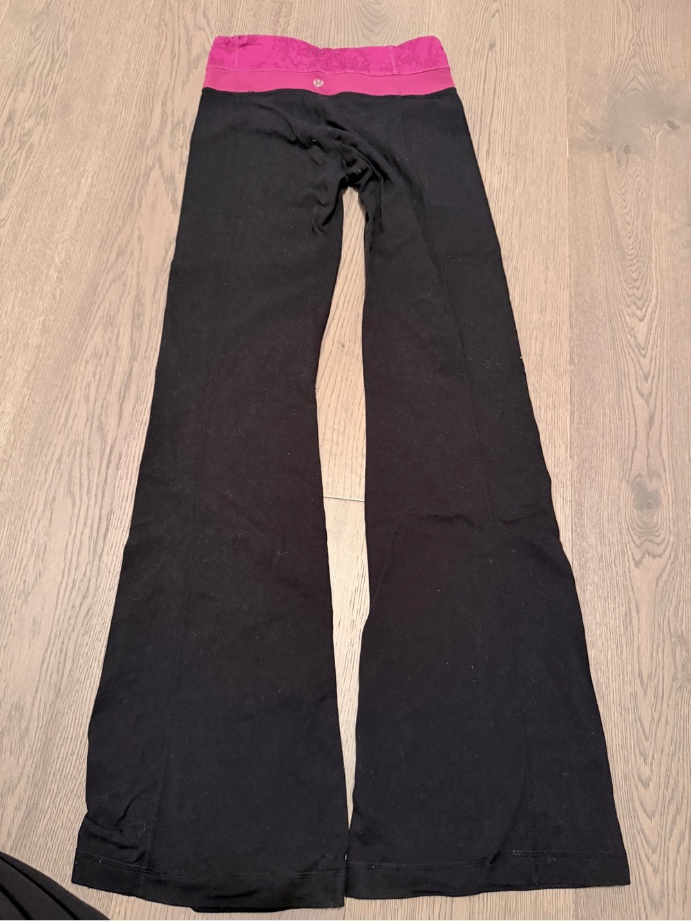 Lululemon Women’s Black Flare Yoga Pants with Pink Waistband